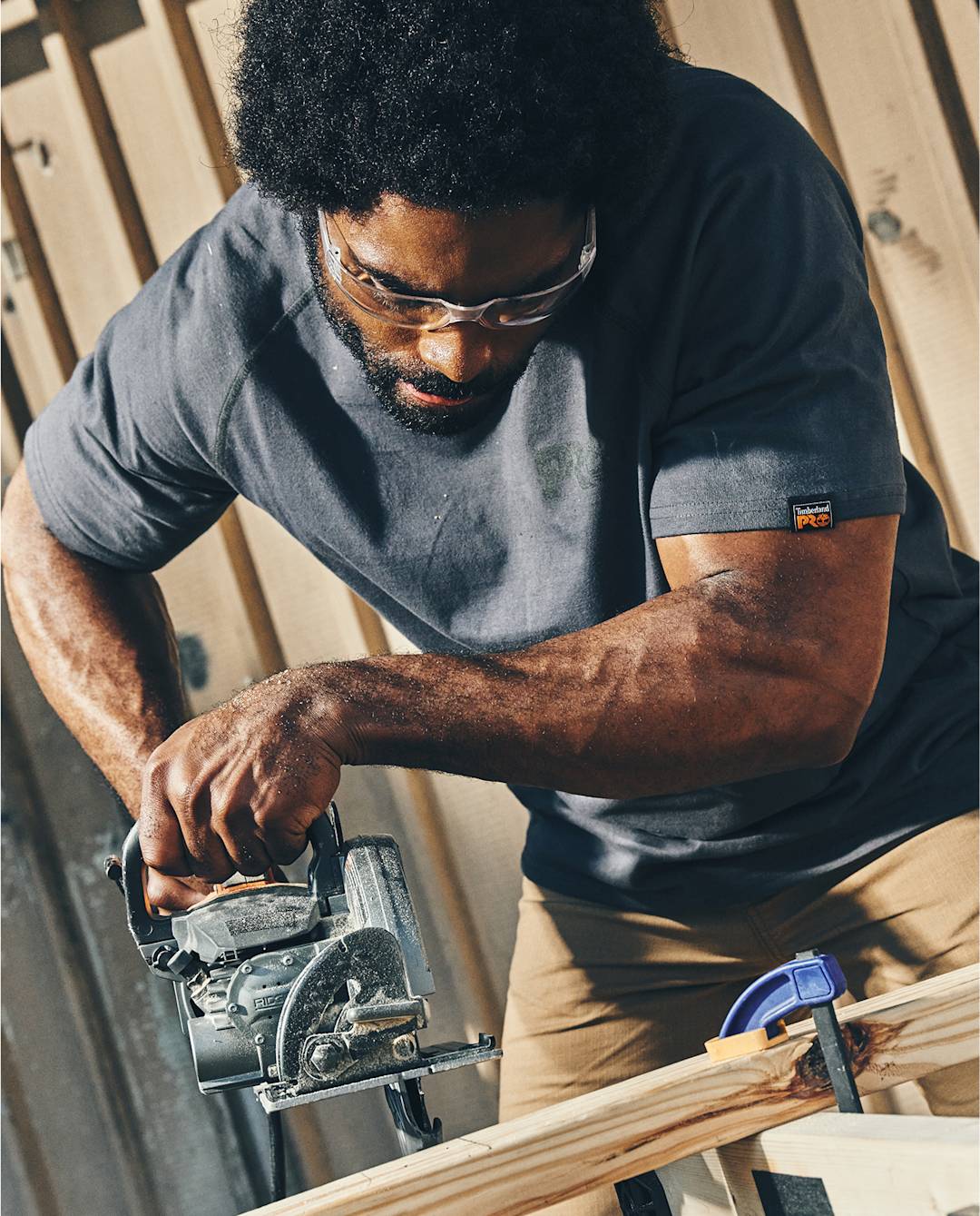 A man wearing Timberland PRO® workwear doing carpentry work.