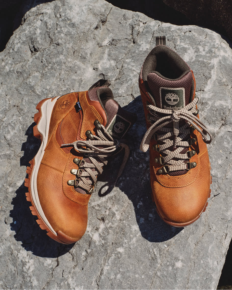 brown hiking boots on a rock