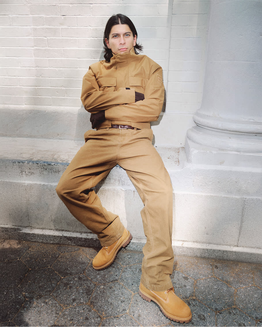 man in brown jacket and brown pants wearing brown boots