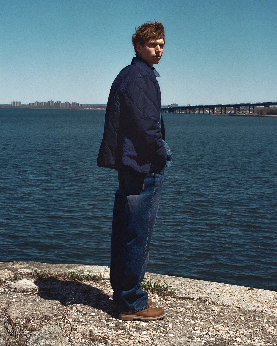 blue coat covered in water droplets
