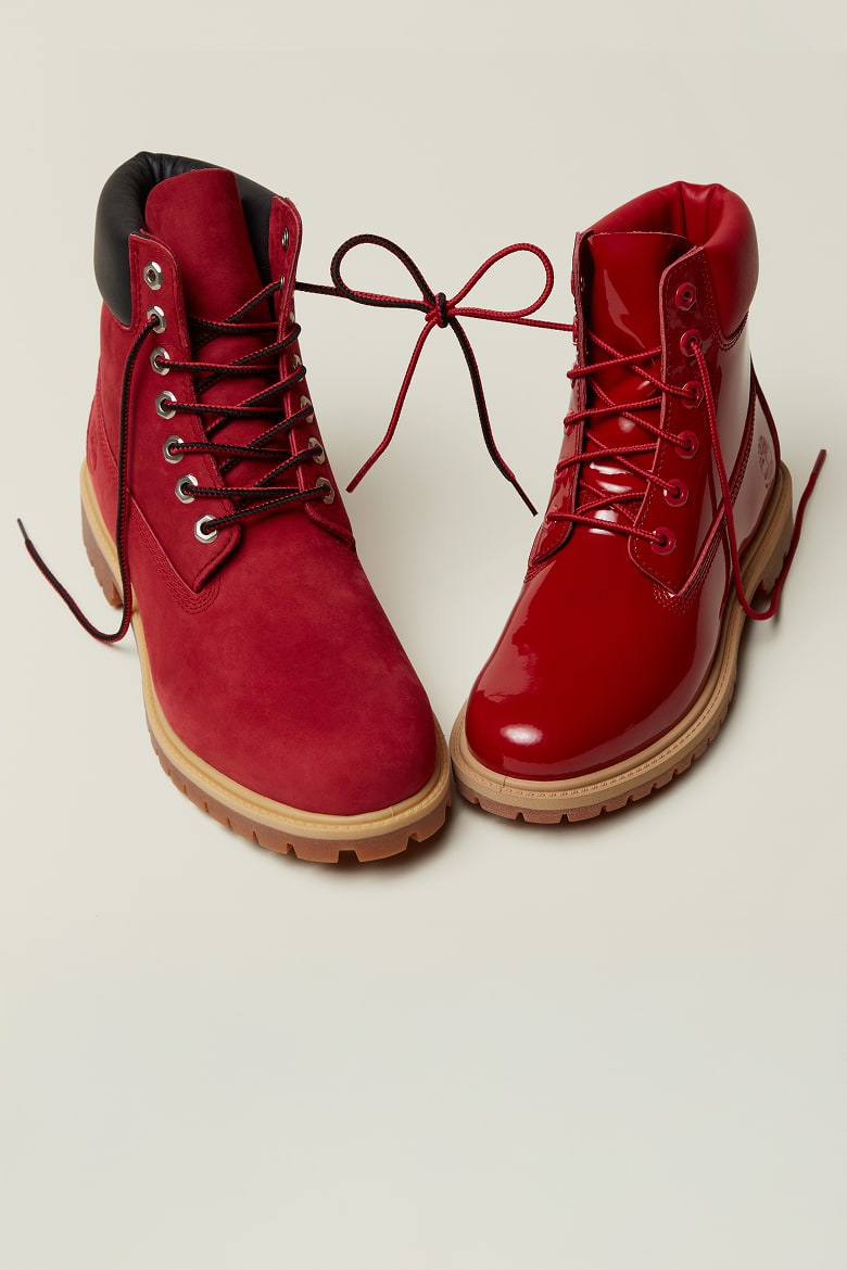 Image of 2 red Timberland boots with the laces tied in a bow