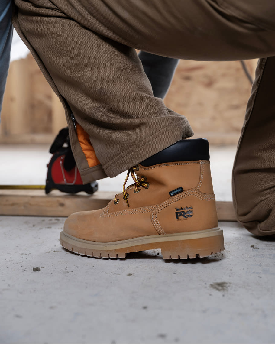 worker bending down in timberland work boots
