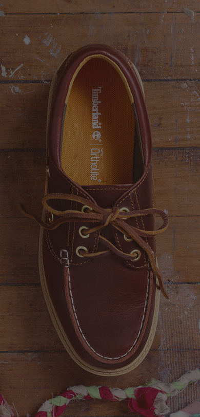 Close up cropping of a boat shoe toe box.