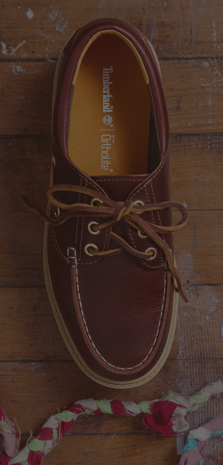 Close up cropping of a boat shoe toe box.