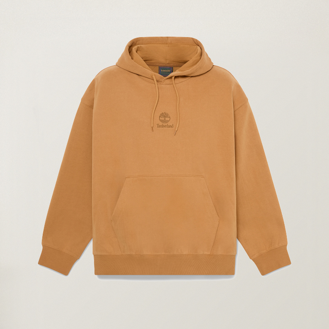 Camel-tan pullover hoodie with drawstring hood, kangaroo pocket, and embroidered Timberland tree logo on the chest.