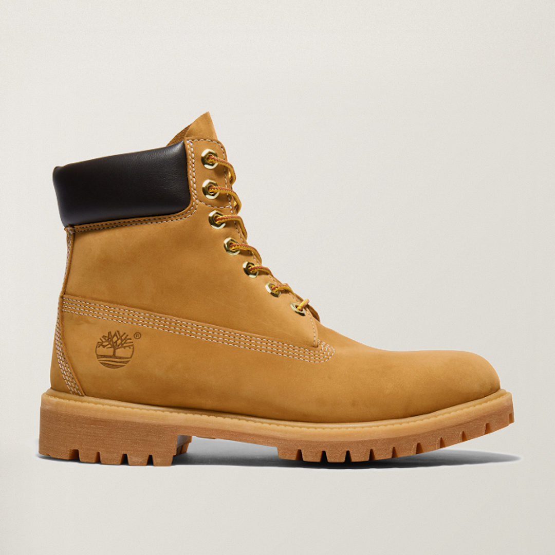 Timberland classic 6-inch premium brown nubuck boot with tan collar and gum lug outsole, side profile view.