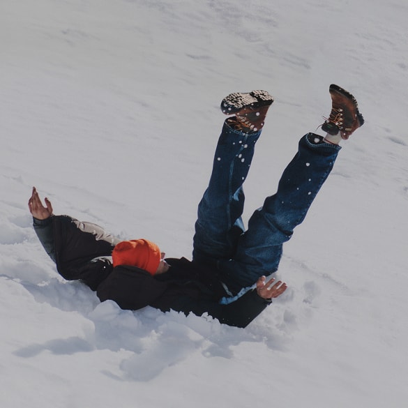 A man falling down in the snow