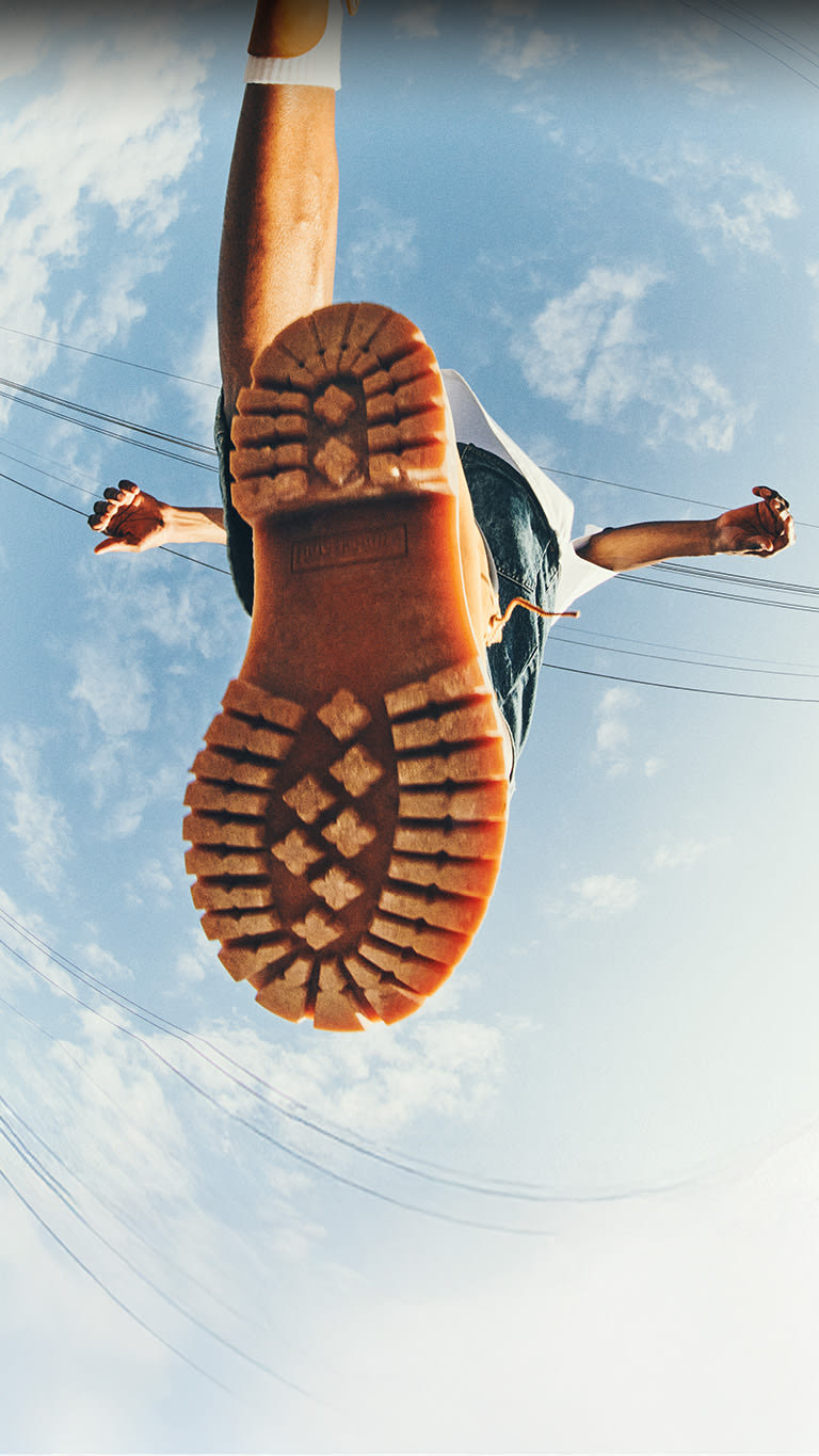 A man stepping in Timberland® Boots.