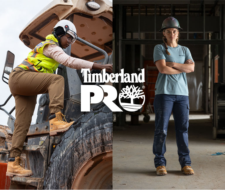 Image collage of a Black woman in a hard hat, wearing a yellow safety vest, climbing up into a large tractor-type machine, and a white woman in two braids and hard hat standing in a warehouse. Both women are wearing wheat colored Timberland work boots.