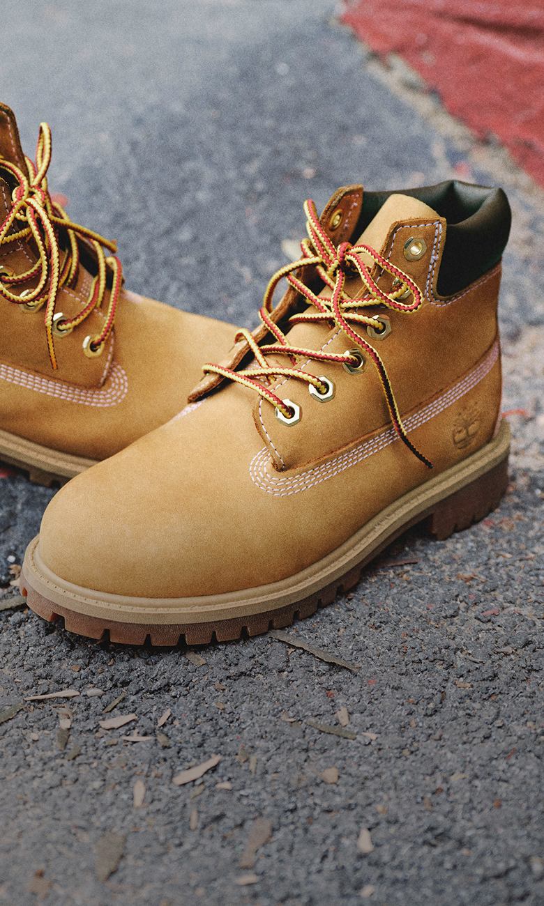 yellow timberland boots on concrete ground