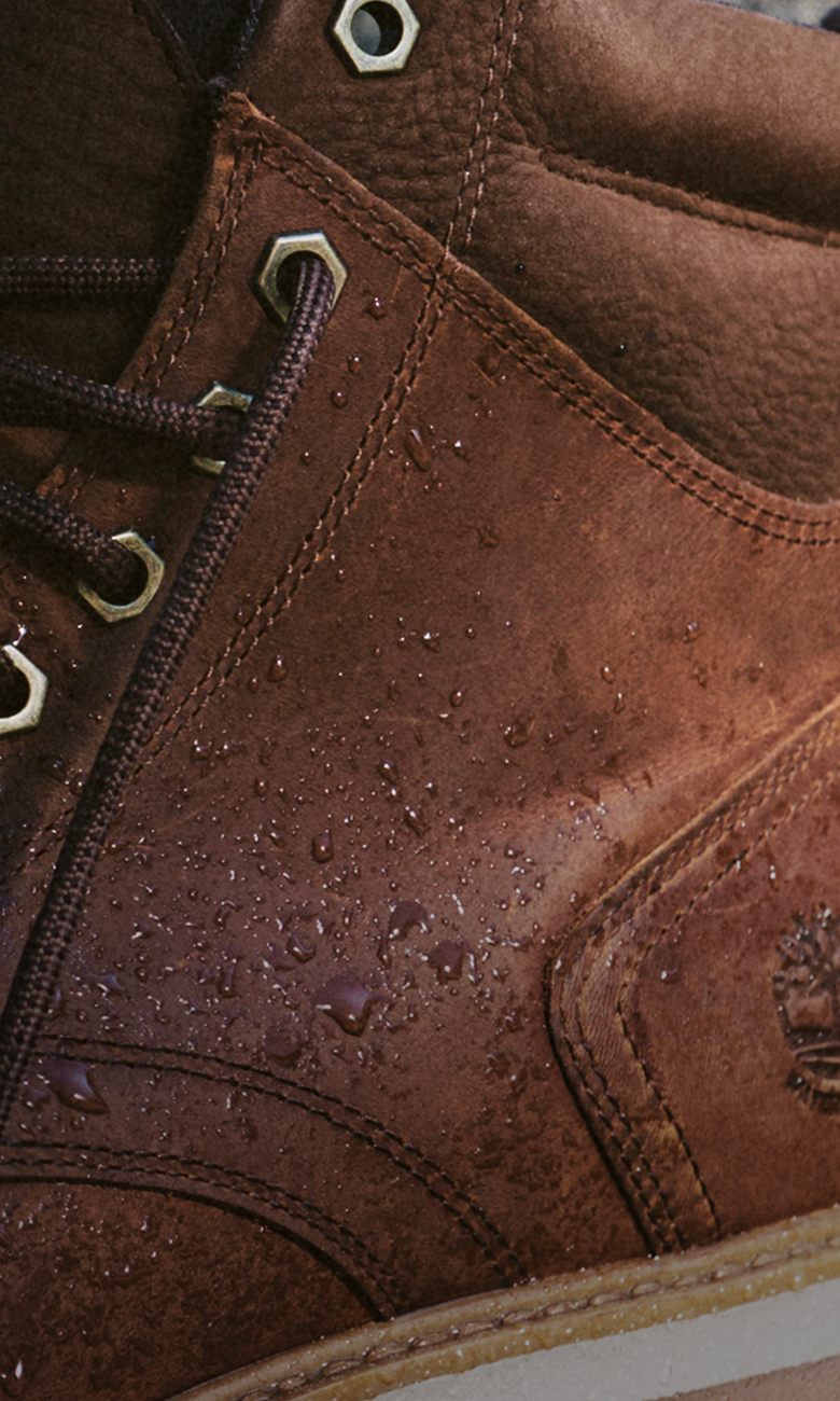close up of water droplets on a brown waterproof leather timberland boot
