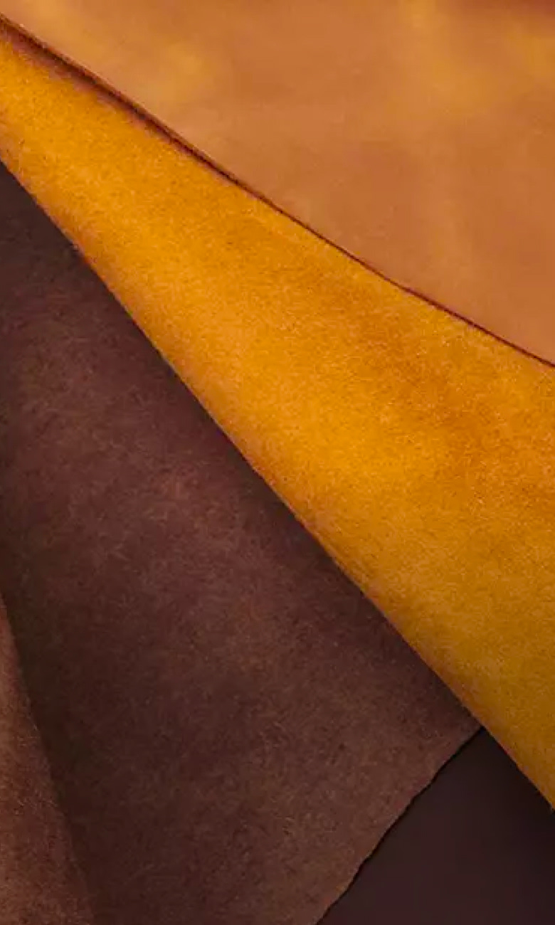 sheets of suede, leather and more fabric layered on top of each other