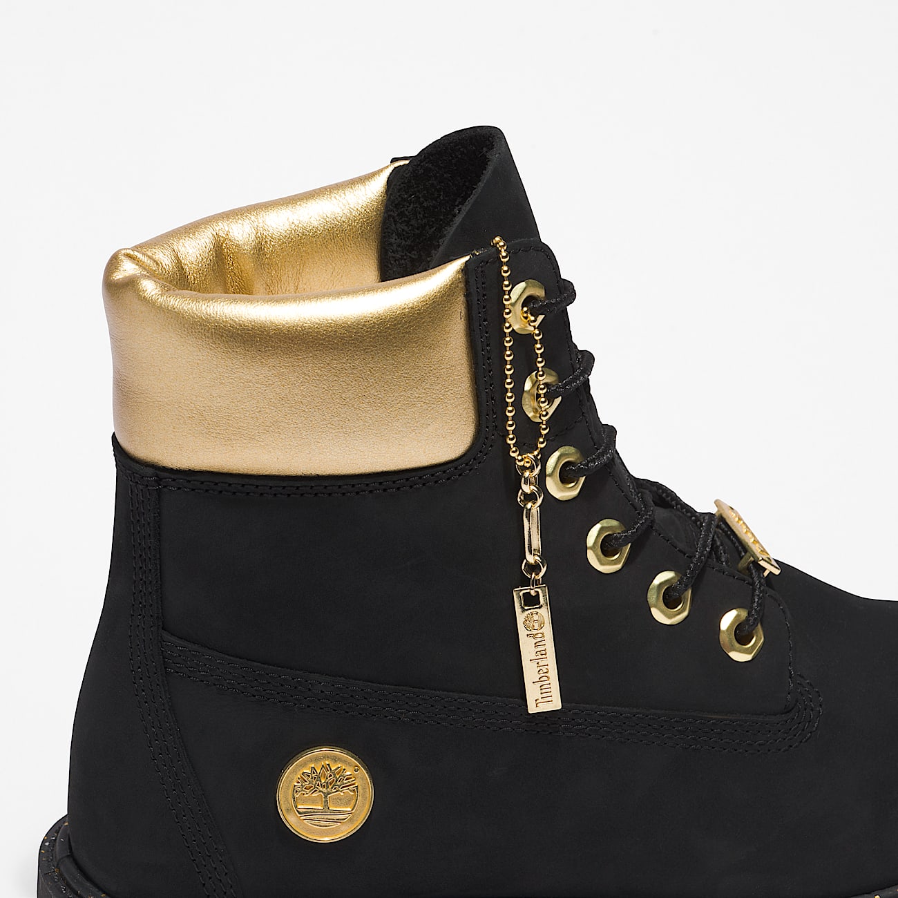 Gold and black timbs on sale